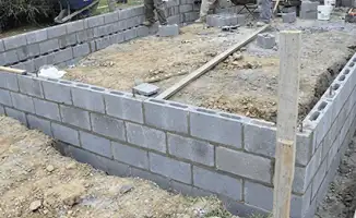 Professionals building a foundation with blocks in Charlotte, NC